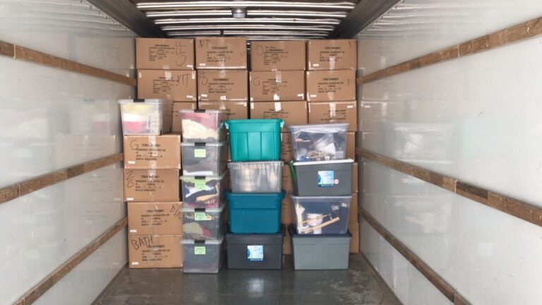 Loaded moving truck with organized boxes and containers by affordable Mississauga movers